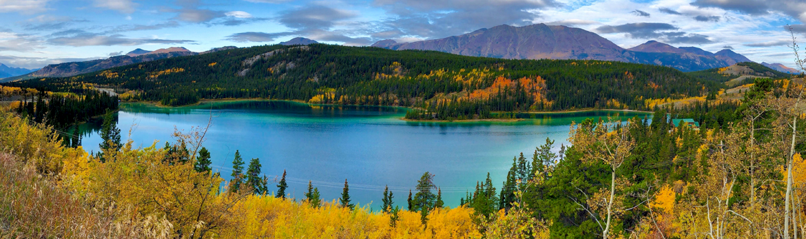 Mountains, water, and canoes lanscape